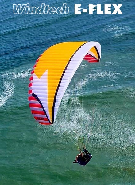 Windtech E-Flex wing flying low over turquoise water